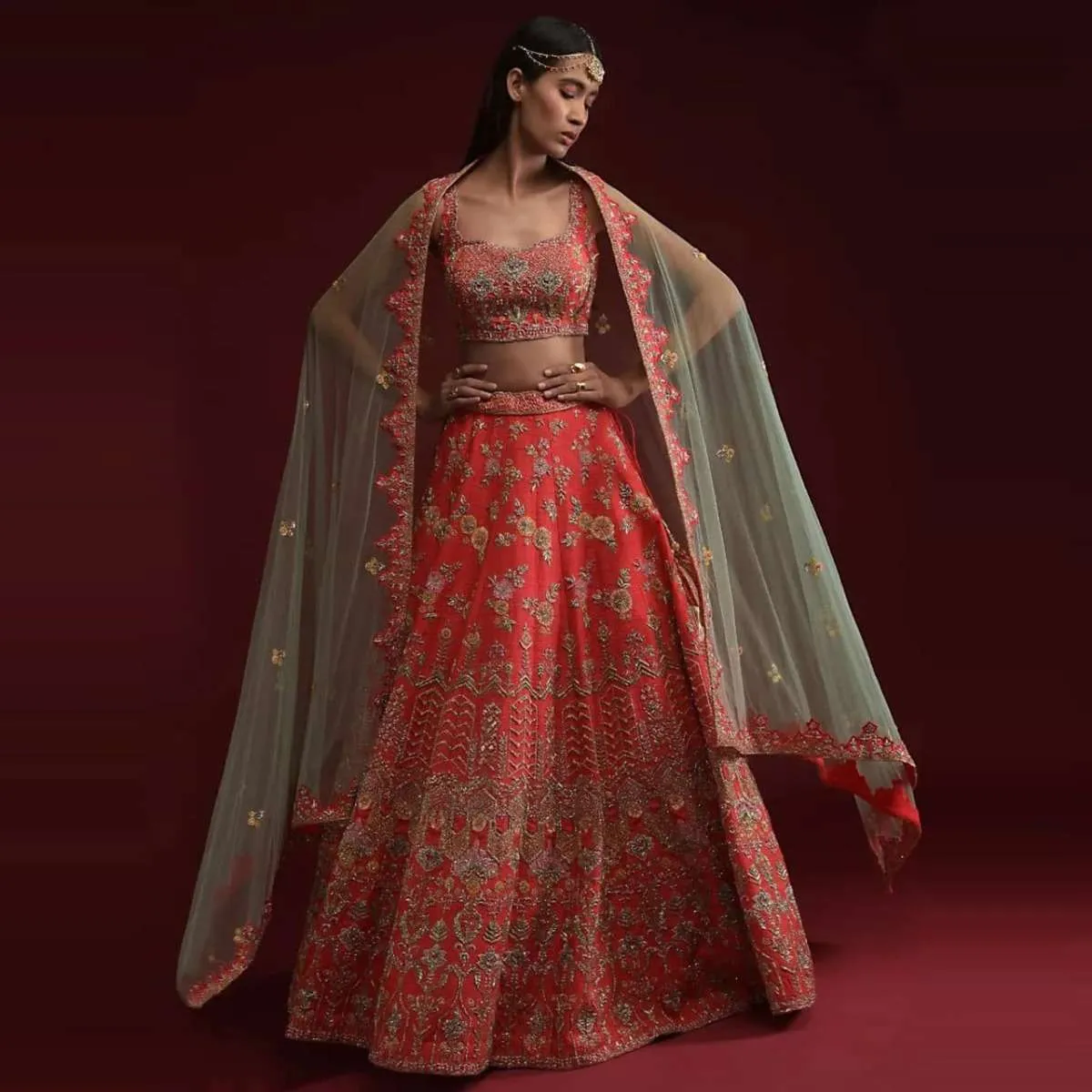 Coral Lehenga Choli In Raw Silk With Hand Embossed Embroidery In Floral And Geometric Motifs Online - Kalki Fashion